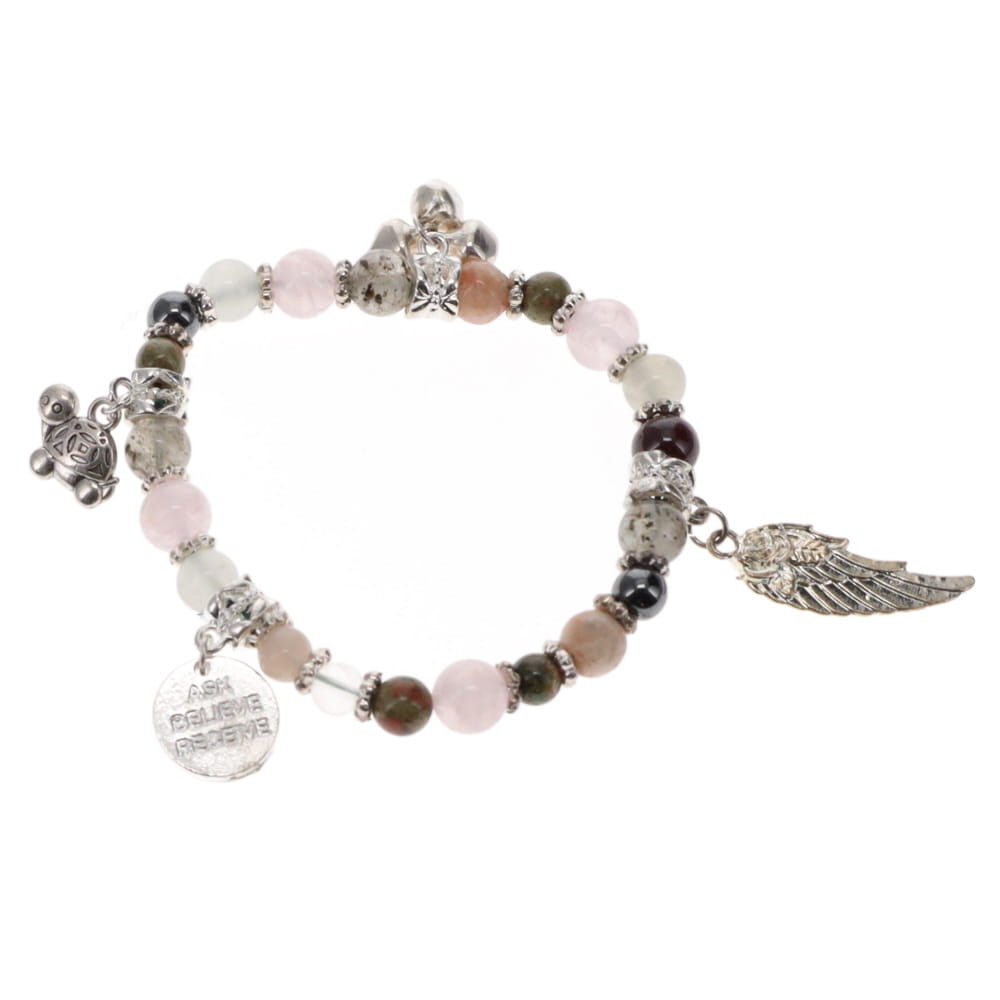 A multicolored crystal bracelet with various charms, including a turtle and an angel wing, on a white background.
