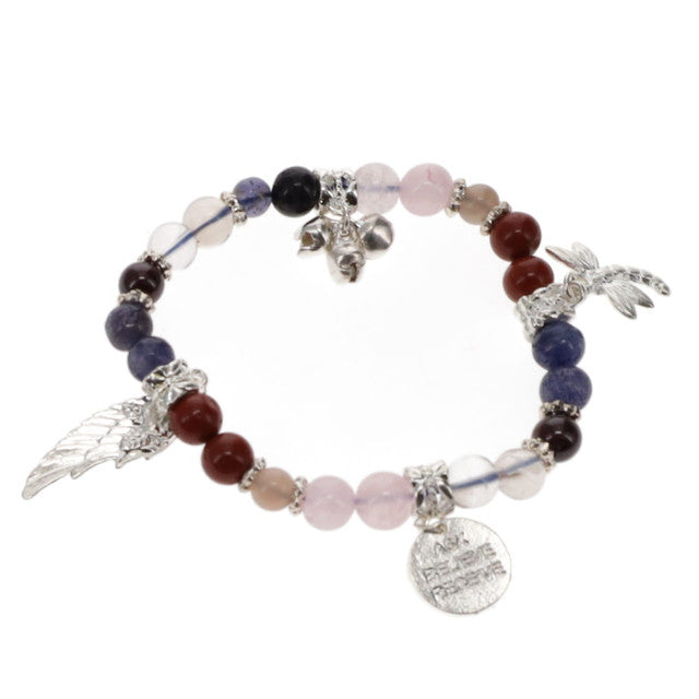 A multicolored beaded bracelet with charms, featuring a mix of round and possibly square charms in silver tones, with a variety of colors including blue, red, and pink.