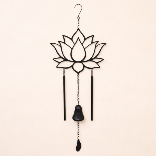 Decorative wind chime with lotus flower design on a beige background